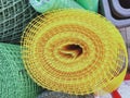 A rolled up yellow plastic polymer mesh Royalty Free Stock Photo