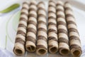 Rolled wafers at the chocolate Royalty Free Stock Photo