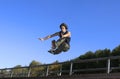Roller boy jumping from parapet Royalty Free Stock Photo