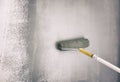 Roller Brush Painting On Wall. Worker Painting On Wall With Gray Paint Royalty Free Stock Photo