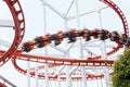 Roller coaster rail loop with motion blur player over cloudy sky Royalty Free Stock Photo