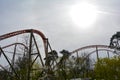 Roller coaster rails between trees Royalty Free Stock Photo