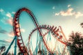 Roller coaster with a red track and white supports. Royalty Free Stock Photo