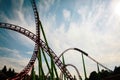 Roller coaster silhouette at sunset in an amusement park. Summer panorama. Copy space Royalty Free Stock Photo