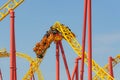 Roller coaster up down turn and a passing loop feint, spiral train of trolleys tends to go down Royalty Free Stock Photo