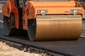 roller compacts asphalt on the road during the construction of the road. compaction of the pavement in road construction. rink Royalty Free Stock Photo