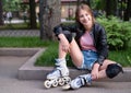 Roller girl resting on border