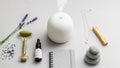 Roller lavender essential oil and a white ultrasonic diffuser Royalty Free Stock Photo