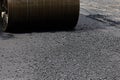 Roller machine working on the asphalt road construction. Royalty Free Stock Photo