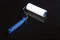 Roller for painting on a black background.A tool to work with Royalty Free Stock Photo