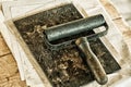 Roller for rolling ink vintage print books. Tools of ancient printing. Roller in an old workshop on typography Royalty Free Stock Photo
