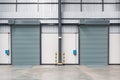 Roller shutter door and concrete floor inside factory Royalty Free Stock Photo