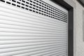 Roller shutter gate. Metal roller garage door as background. Automatic electric roll-up garage gate. Garage with white rolling Royalty Free Stock Photo