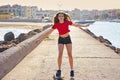 Roller Skate girl in a beach dock with red