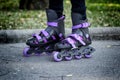 Roller skates on beautiful girl`s feet