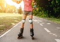 Roller skates on girl in park Royalty Free Stock Photo