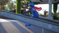 Roller-skating, child on sporting competition acceleration from hill at rollerdrome