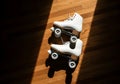 Roller Skating Shoes on Polished Wood Floor Royalty Free Stock Photo