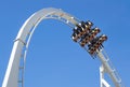 Rollercoaster Ride and loop against blue sky