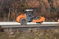 rollers rolling fresh hot asphalt on the new road road construction Royalty Free Stock Photo