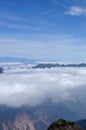 Rolling clouds and mountain summits andscape