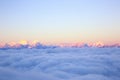 Rolling clouds and sunrise snow mountain landscape Royalty Free Stock Photo