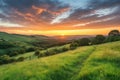 rolling countryside hills, with colorful sunrise and clouds in the background