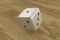 Rolling dice on wooden background