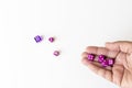 Rolling Dices in hand and on a white table Royalty Free Stock Photo