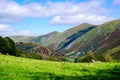 Rolling fells and valley in the Lake District with green fields in the summertime Royalty Free Stock Photo