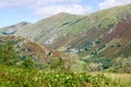 Rolling fells and valley in the Lake District with green fields in the summertime Royalty Free Stock Photo
