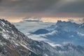 Rolling fog and sun rays at dawn in Karawanken Karavanke range Royalty Free Stock Photo