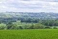 Rolling hills with green fields, rural villages, woodlands