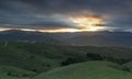 Rolling Hills and Ominous Sky Sunset via Coyote Peak Royalty Free Stock Photo