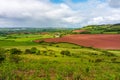 Rolling hills and patchwork fields in Devon in a lush countryside under a cloudy sky Royalty Free Stock Photo