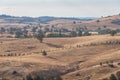 Rolling landscape of paddock hills and outback farmlands Royalty Free Stock Photo