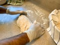 Rolling out Bread Dough at Home on a Floured Kitchen Countertop Royalty Free Stock Photo