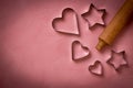 Rolling pin with cookie cutters in the shape of a star and heart