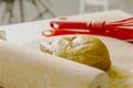 Rolling pin and dough with egg whisk