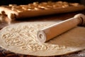 rolling pin flattening dough on floured surface