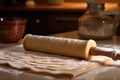 rolling pin flattening pasta dough for