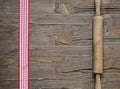 Rolling pin and red and white ribbon Royalty Free Stock Photo