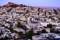 Rolling San Francisco hills with peaked roof homes and streets at golden hour