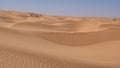 Rolling sand dunes in the Sahara desert Royalty Free Stock Photo