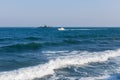 Seascape with military ship and motor yacht