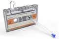 Rolling up old cassette tape for recording music on white background Royalty Free Stock Photo