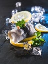 Rollmop herring on lemon slices and ice cubes Royalty Free Stock Photo