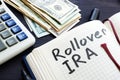 Rollover ira handwritten in a notepad. Retirement. Royalty Free Stock Photo