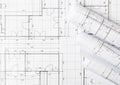 Rolls of architectural blueprint house building plans on blueprint background flat lay Royalty Free Stock Photo