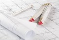 Rolls of architectural blueprint house building plans with pencil and folding ruler on blueprint background Royalty Free Stock Photo